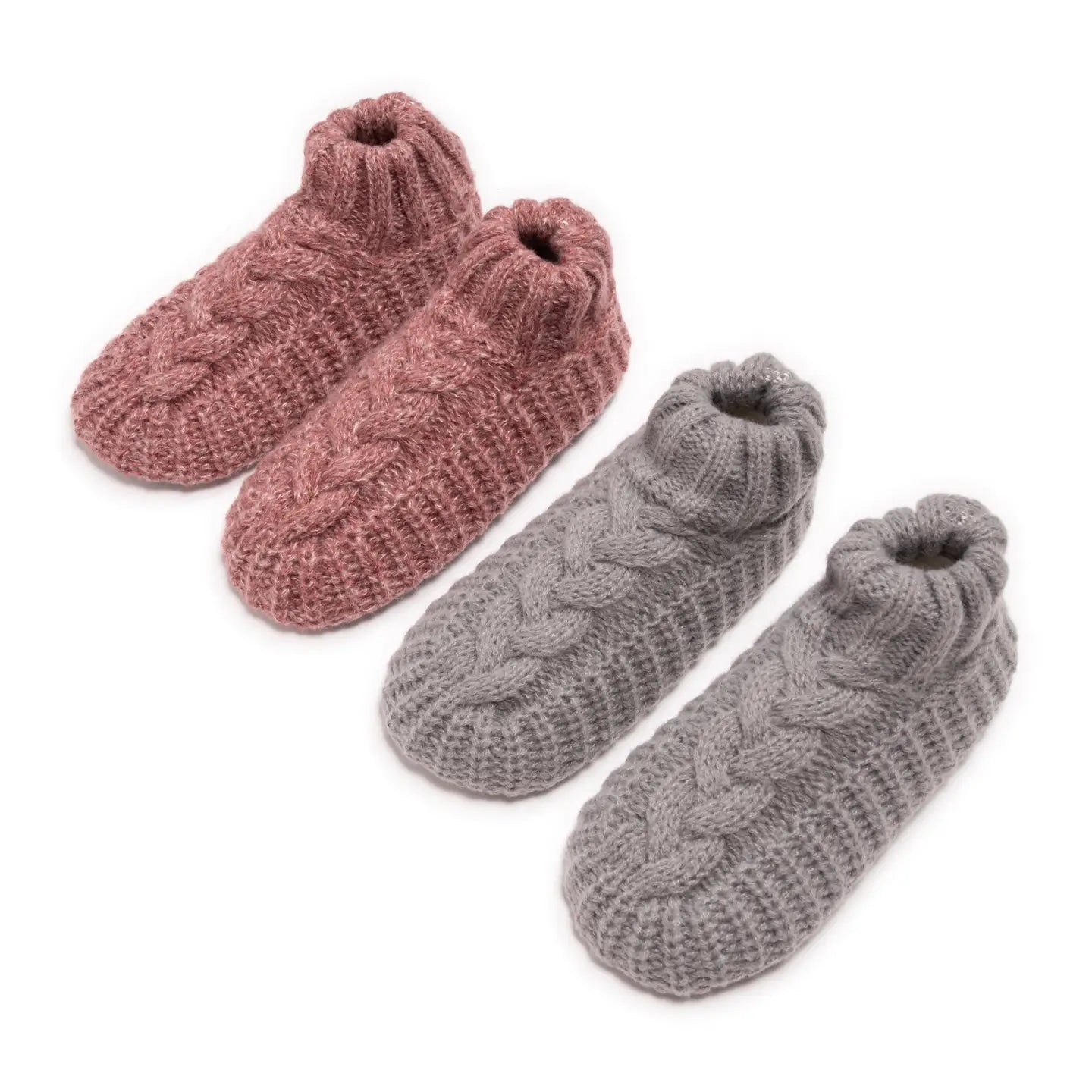 cozy cable-knit slipper socks, one in dusty rose and one in soft gray, displayed side by side on a white background.”